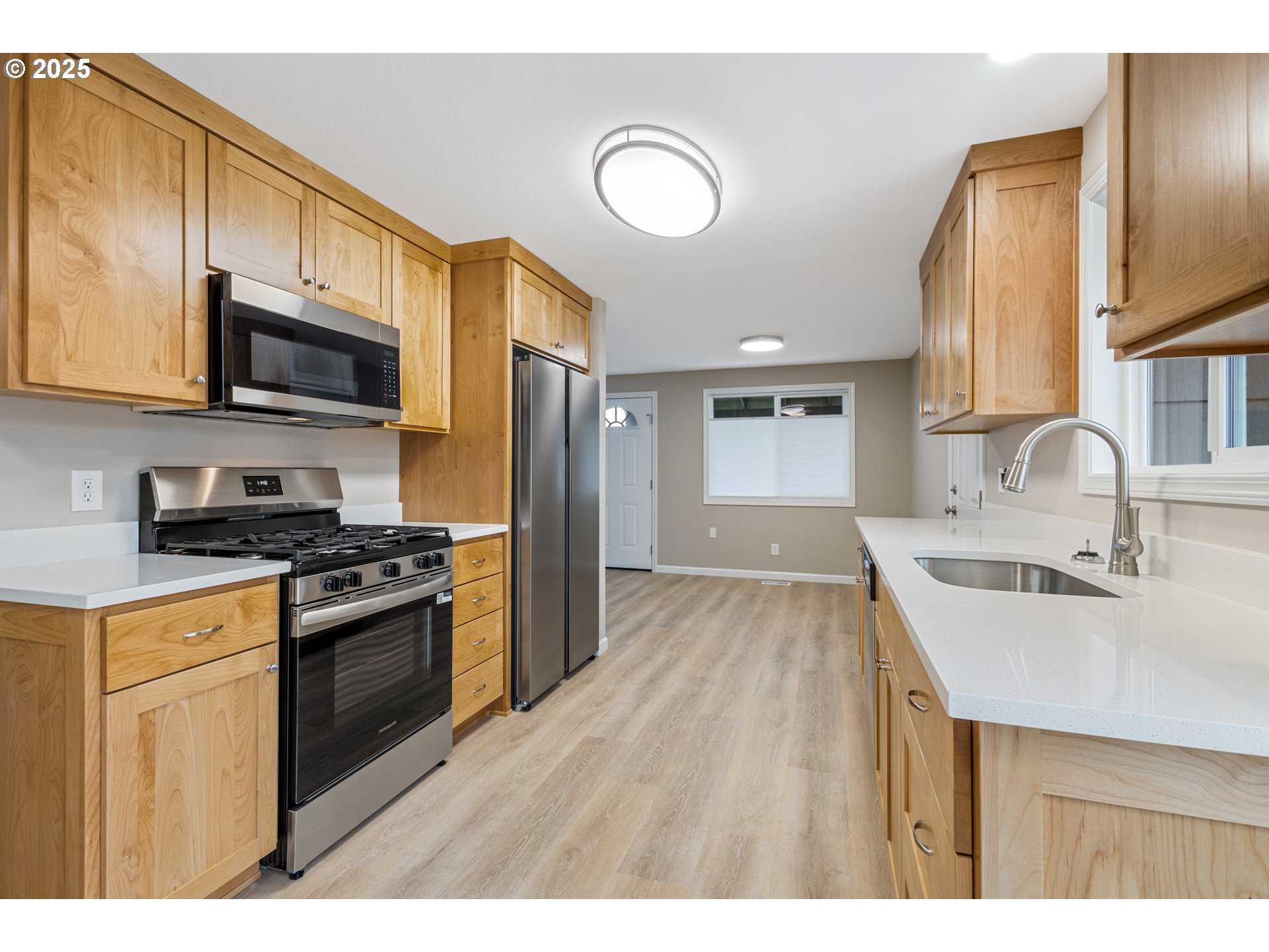 1822 Hawthorne Street Forest Grove, OR 97116 - Photo 12 of 18 a kitchen with stainless steel appliances granite countertop a sink stove and refrigerator