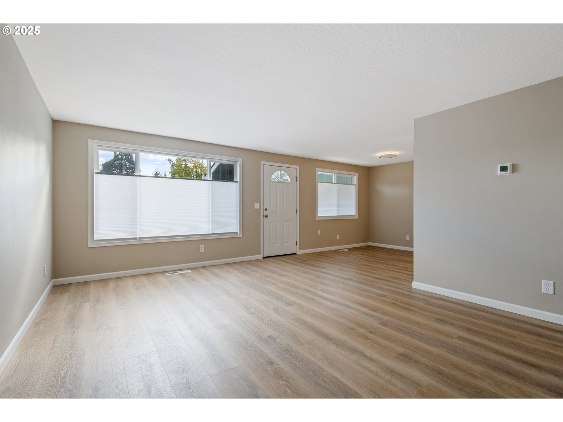 1822 Hawthorne Street Forest Grove, OR 97116 - Photo 10 of 18 a view of an empty room with wooden floor and closet