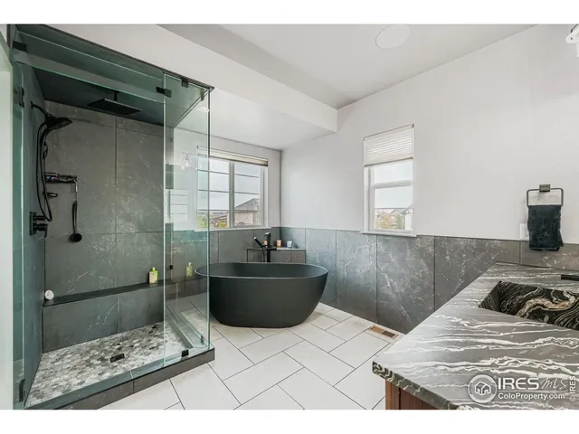 a bedroom with a bed and a mirror