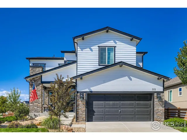 a front view of a house with a garage