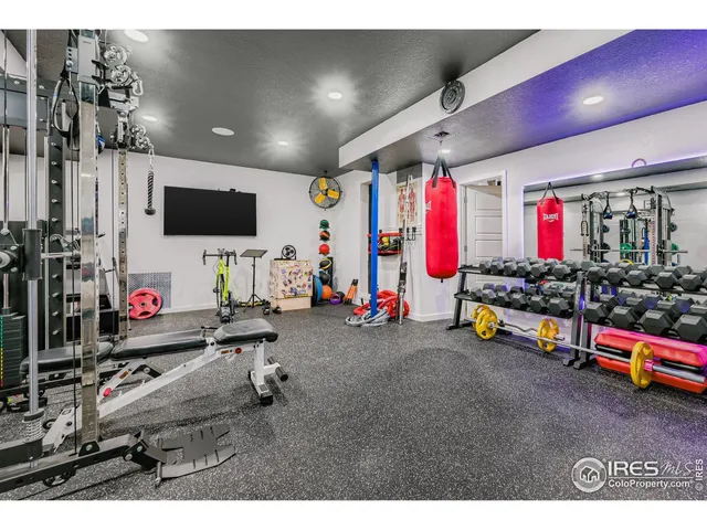 a room with lots of storage and a flat screen tv