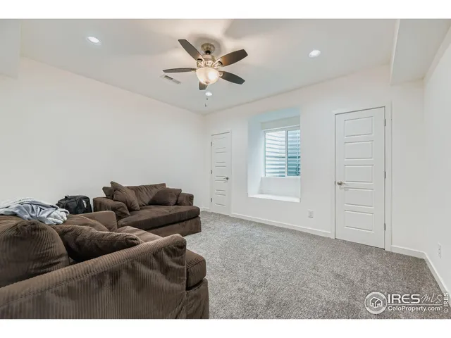 a bathroom with a sink vanity mirror and toilet