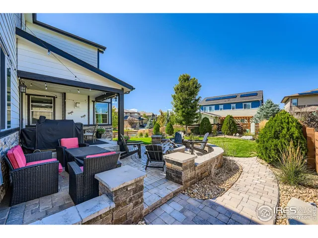 a front view of house with yard and outdoor seating