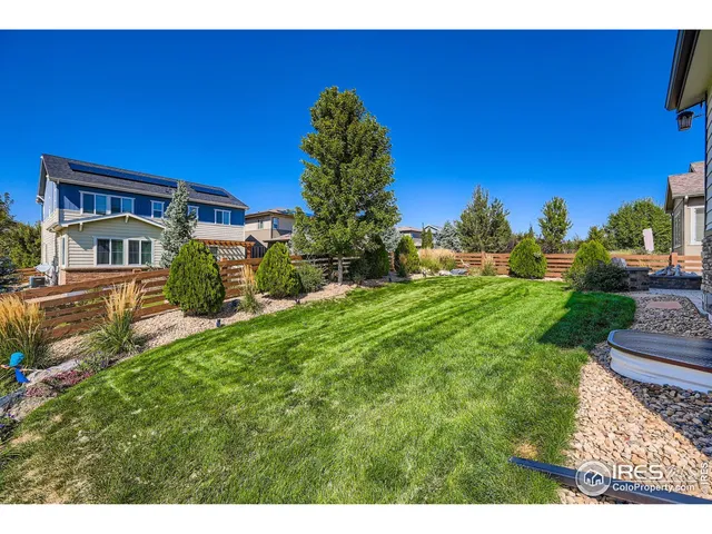 a view of house with yard