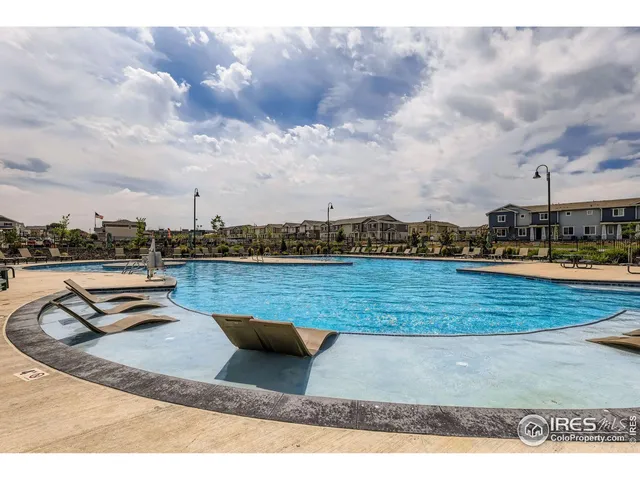 a dining hall view with a large dining table and chairs
