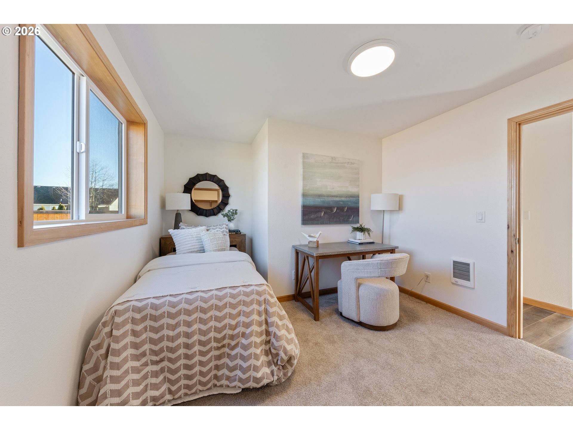 715 ST Charles Street Eugene, OR 97402 - Photo 27 of 30 a bedroom with a bed and a chandelier