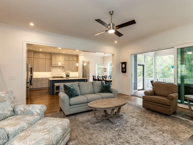 a living room with furniture fireplace and flat screen tv