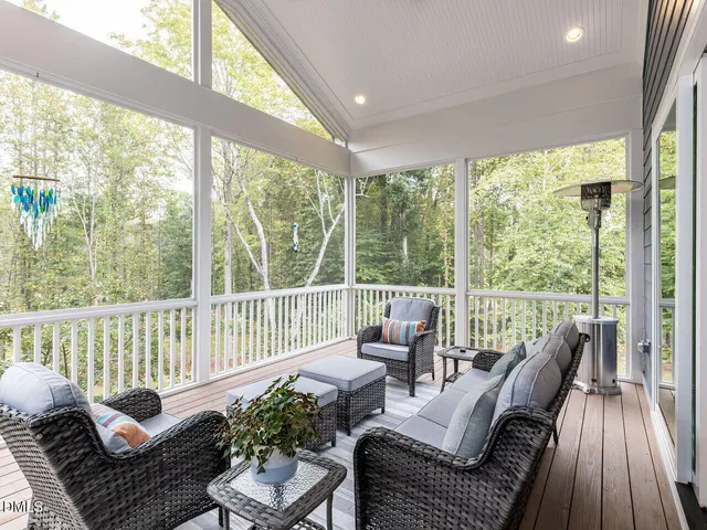 a view of a deck with table and chairs and wooden floor