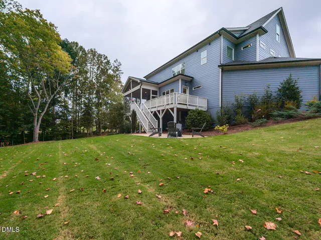 a spacious bedroom with a bed and window