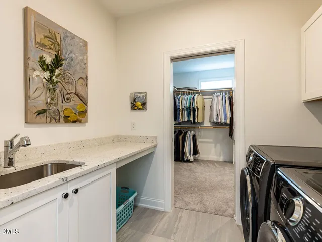 a view of a hallway with wooden floor and entryway