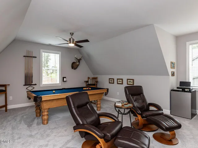 a en suite bathroom with a double vanity sink and a mirror