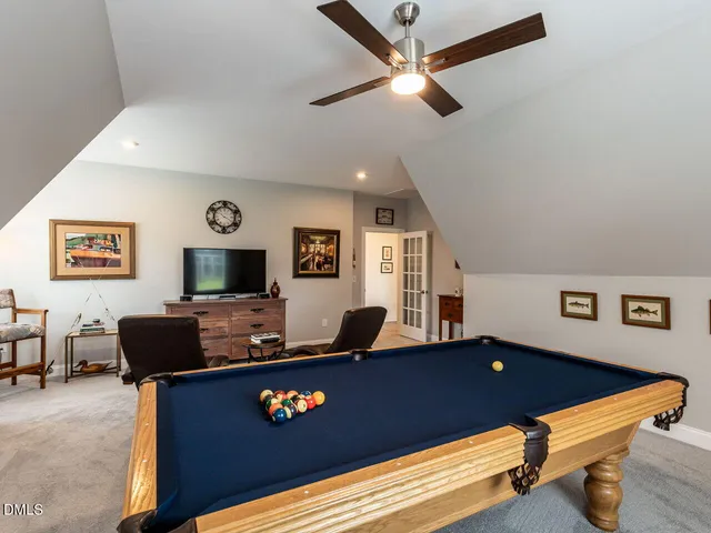 a bathroom with double sink and a mirror
