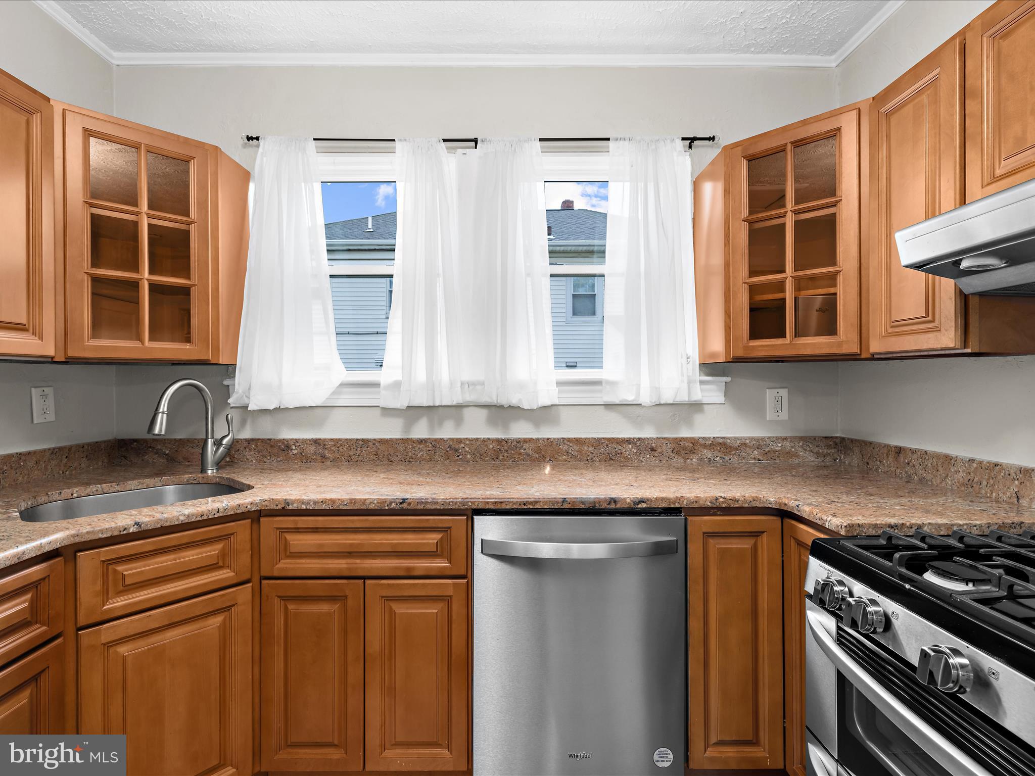 112 Homewood Road Linthicum Heights, MD 21090 - Photo 16 of 44 a kitchen with stainless steel appliances granite countertop a sink stove and cabinets
