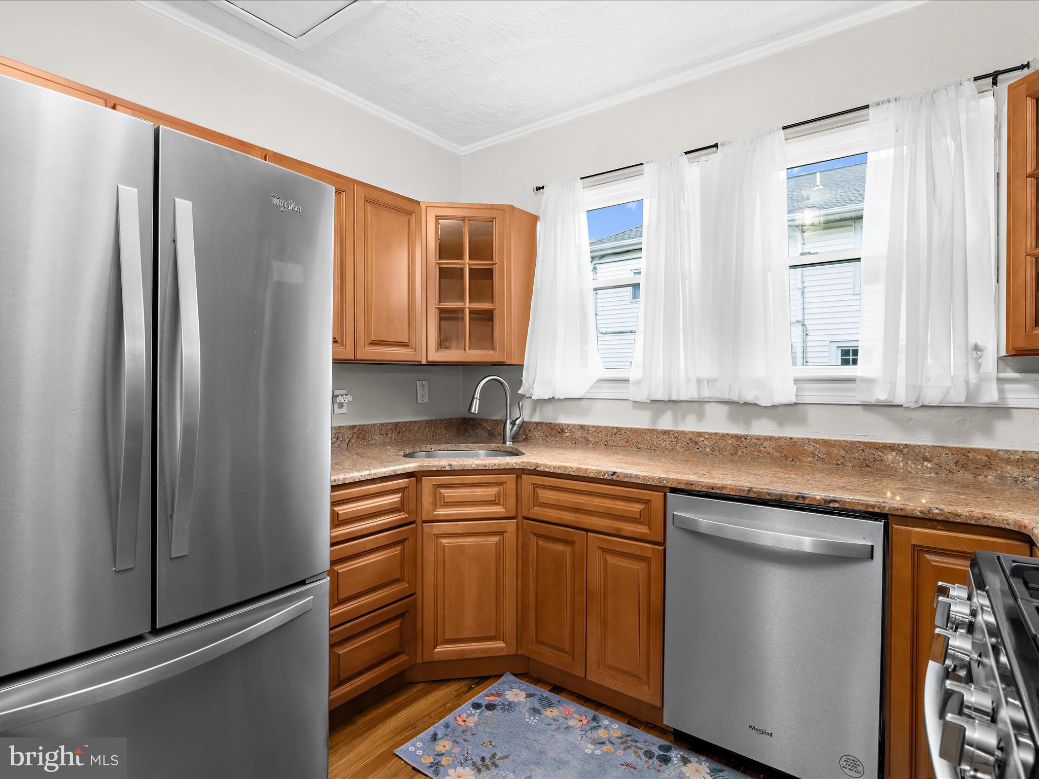 112 Homewood Road Linthicum Heights, MD 21090 - Photo 17 of 44 a kitchen with stainless steel appliances granite countertop a refrigerator and a sink