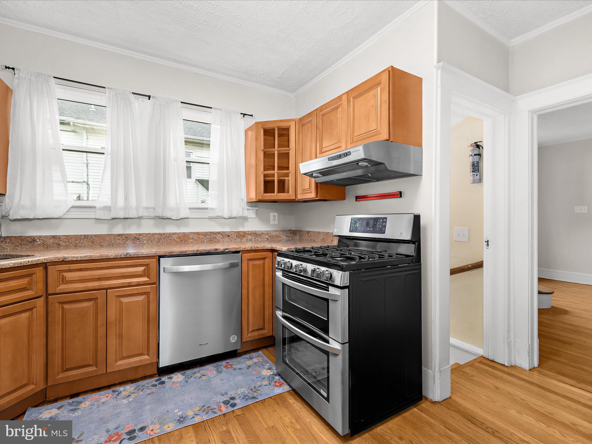 112 Homewood Road Linthicum Heights, MD 21090 - Photo 18 of 44 a kitchen with stainless steel appliances granite countertop a stove a sink and a refrigerator