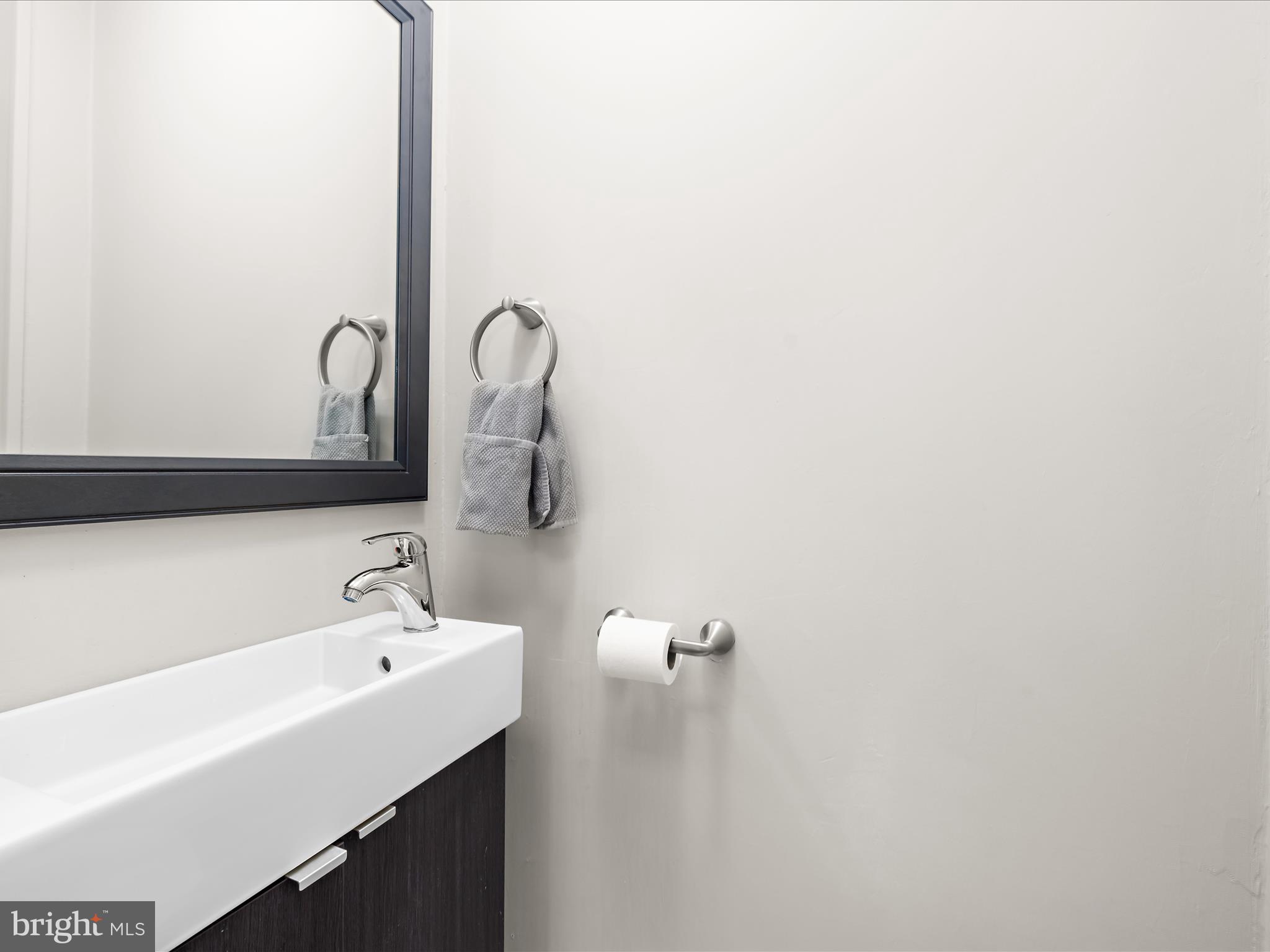 112 Homewood Road Linthicum Heights, MD 21090 - Photo 19 of 44 a bathroom with a sink and a mirror