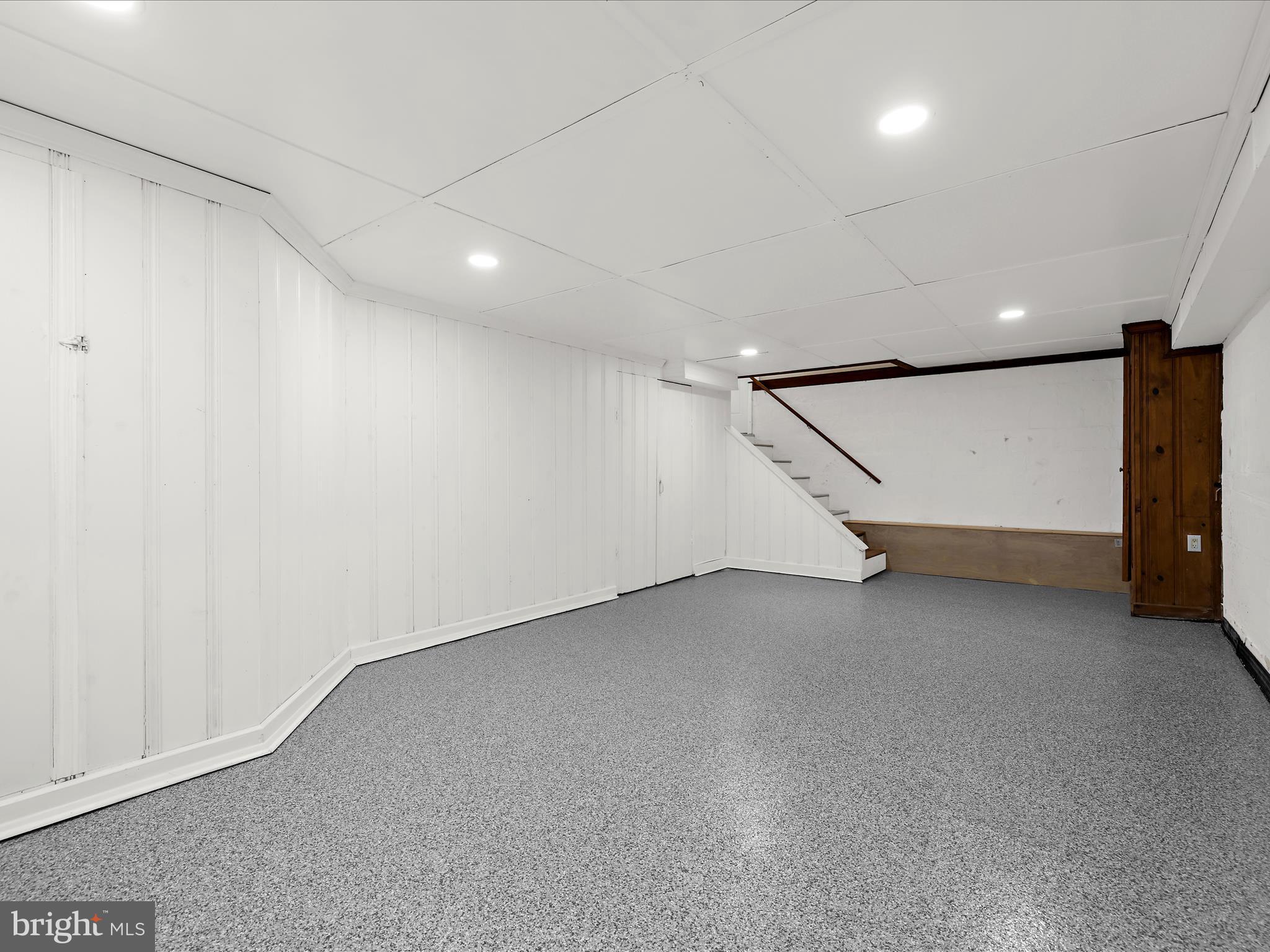 112 Homewood Road Linthicum Heights, MD 21090 - Photo 22 of 44 an empty room with wooden floor and windows