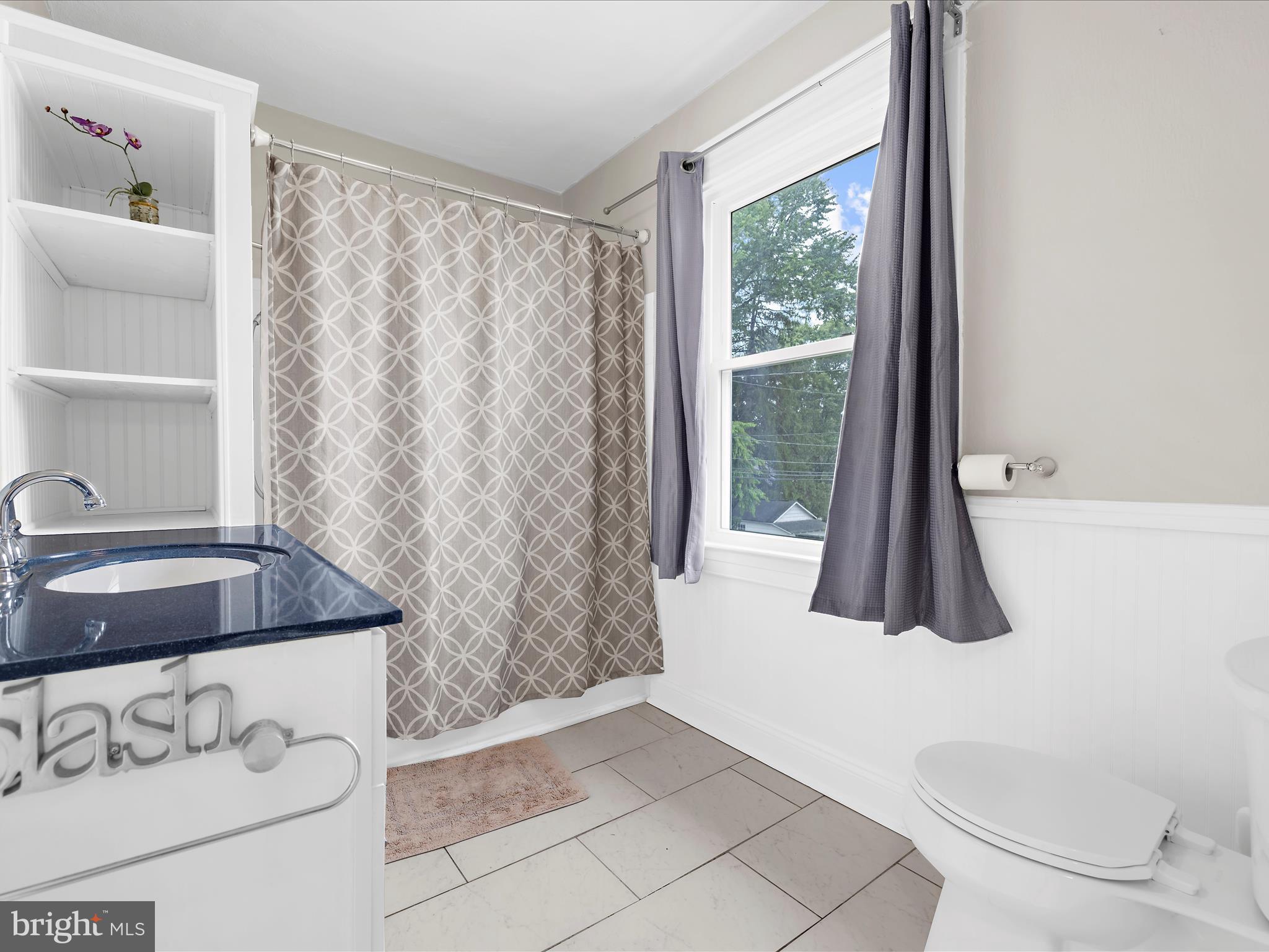 112 Homewood Road Linthicum Heights, MD 21090 - Photo 24 of 44 a bathroom with a sink a toilet and a tub