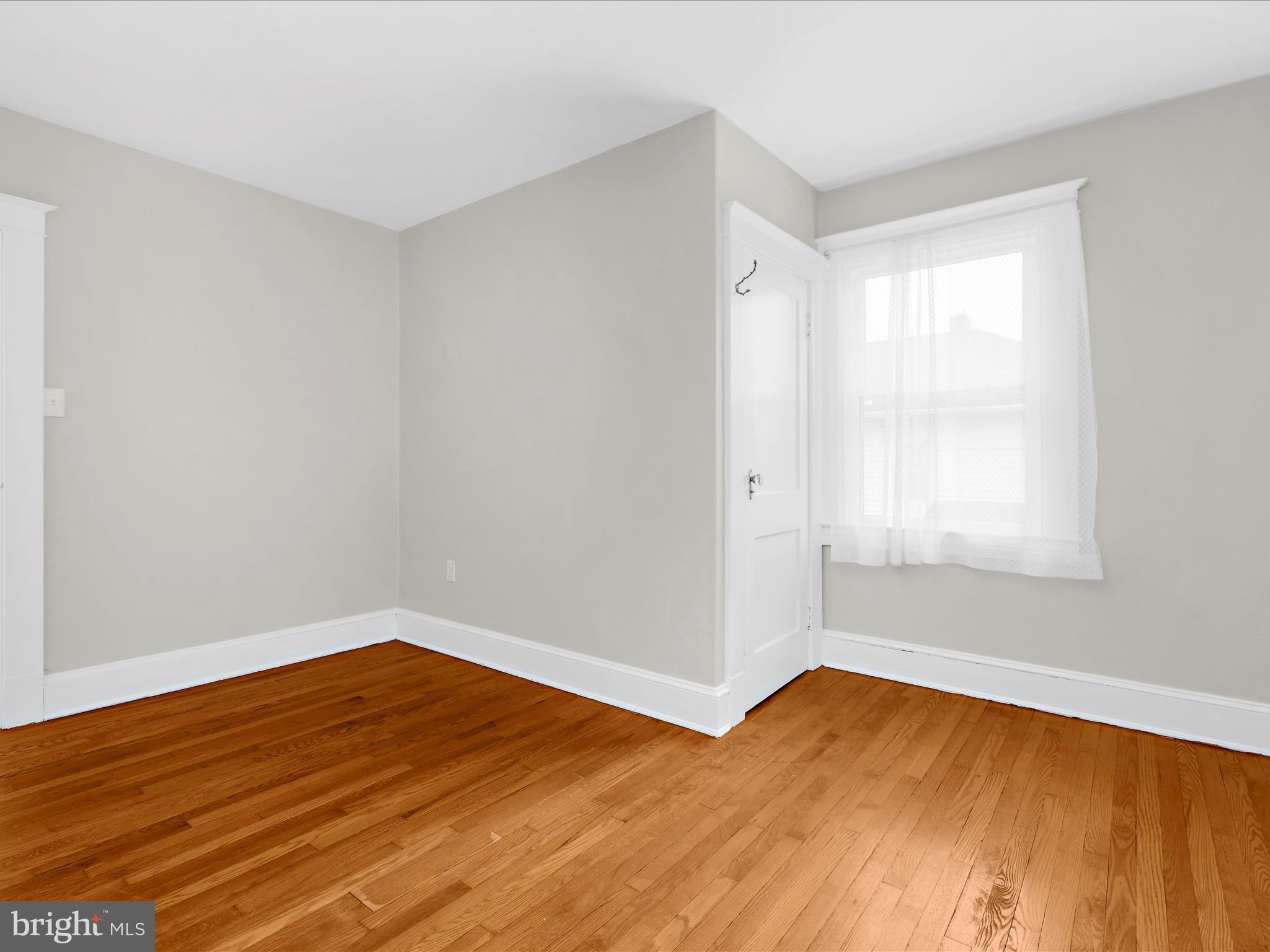 112 Homewood Road Linthicum Heights, MD 21090 - Photo 27 of 44 a view of empty room with wooden floor and fan