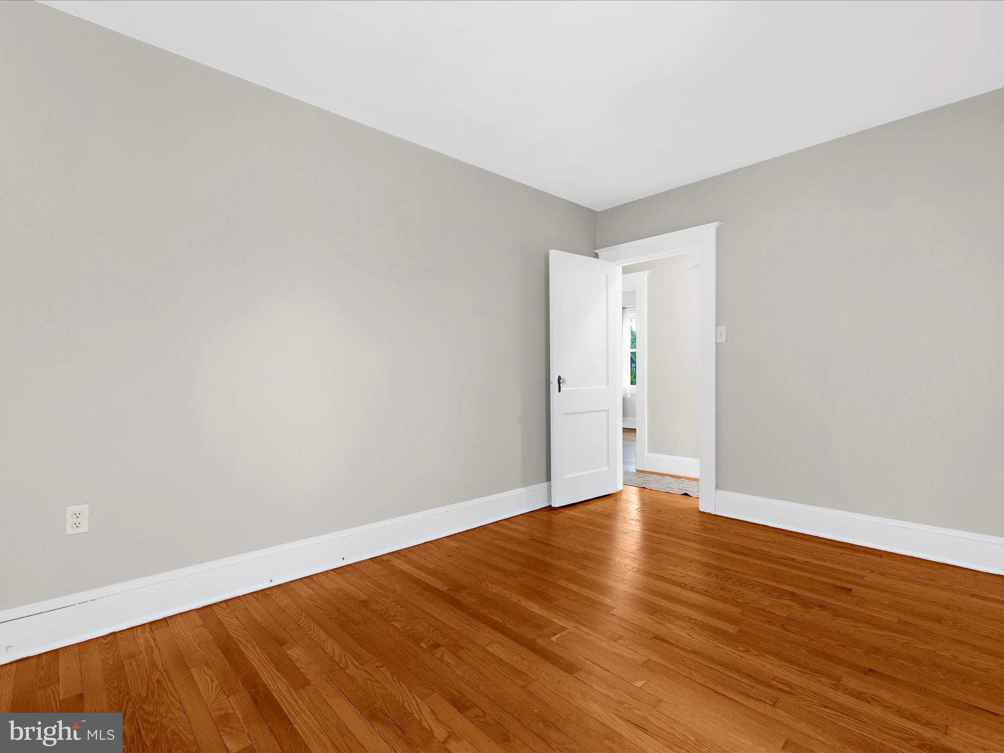 112 Homewood Road Linthicum Heights, MD 21090 - Photo 28 of 44 a view of an empty room with wooden floor