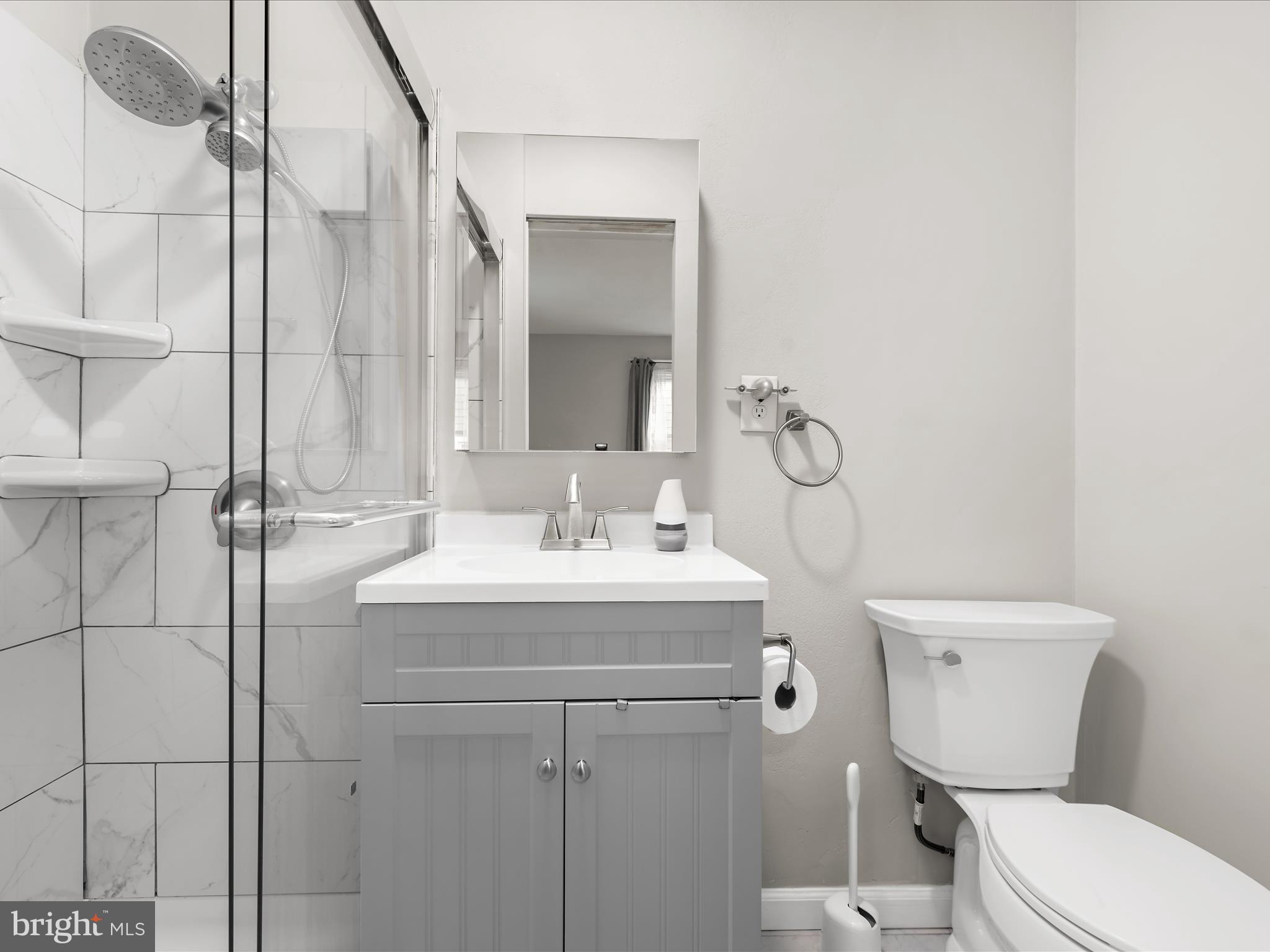 112 Homewood Road Linthicum Heights, MD 21090 - Photo 33 of 44 a bathroom with a toilet sink and mirror