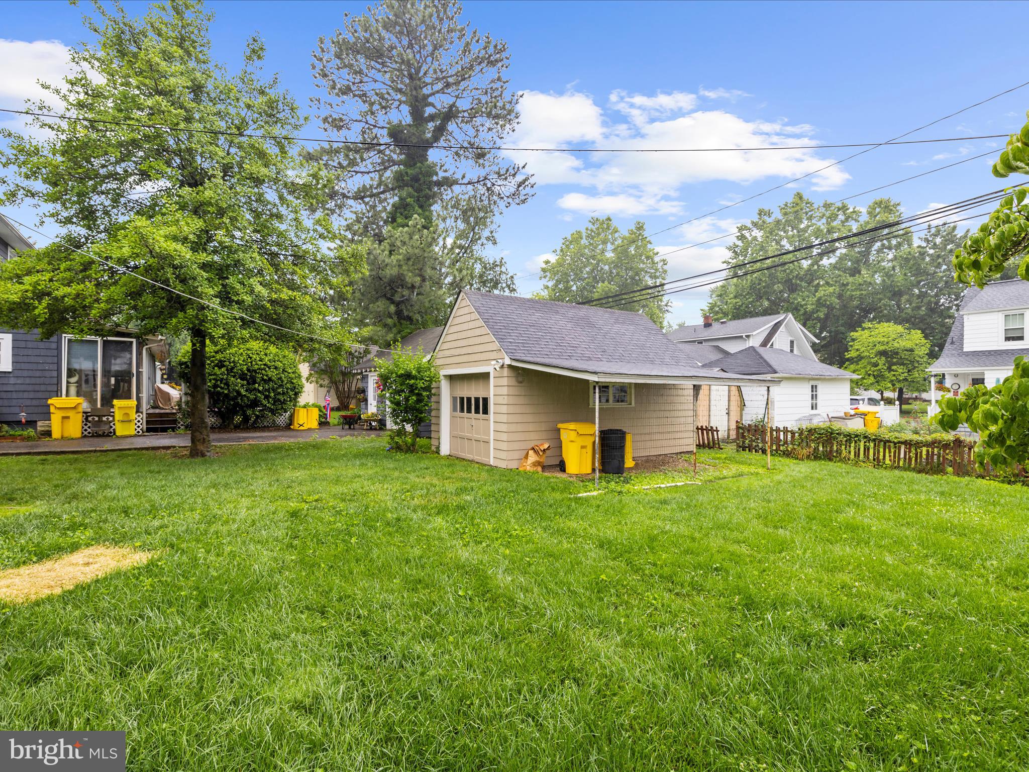 112 Homewood Road Linthicum Heights, MD 21090 - Photo 41 of 44 a front view of a house with a garden and trees