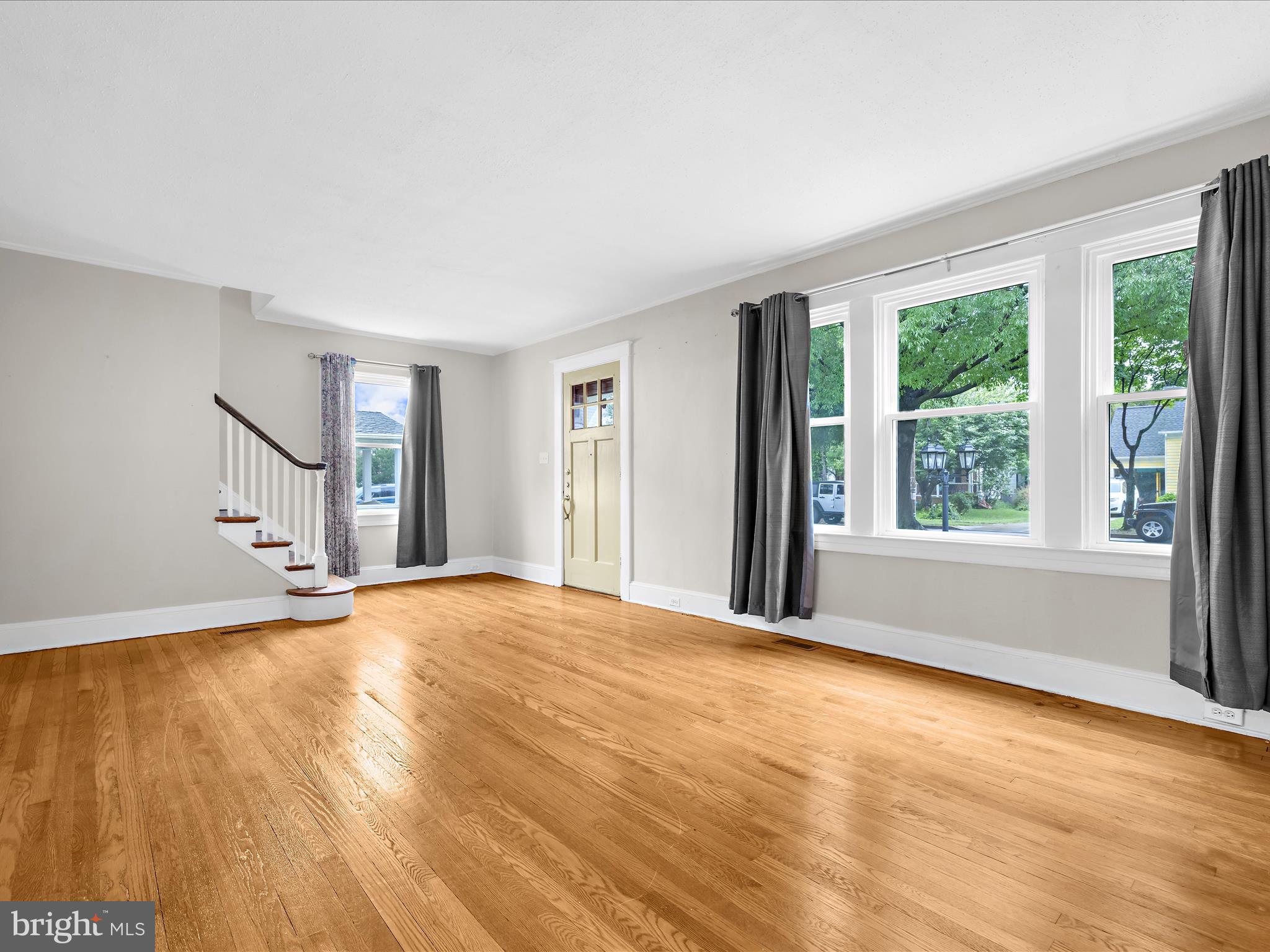 112 Homewood Road Linthicum Heights, MD 21090 - Photo 6 of 44 a view of an empty room with wooden floor and a window