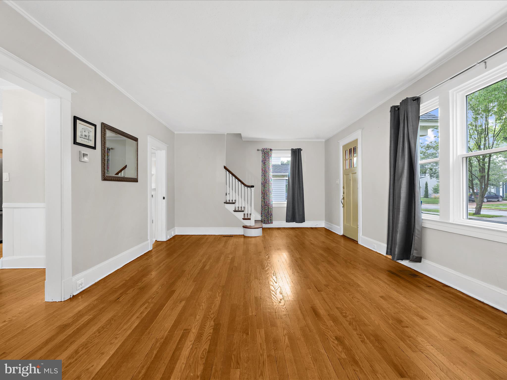 112 Homewood Road Linthicum Heights, MD 21090 - Photo 9 of 44 a view of empty room with wooden floor and fan