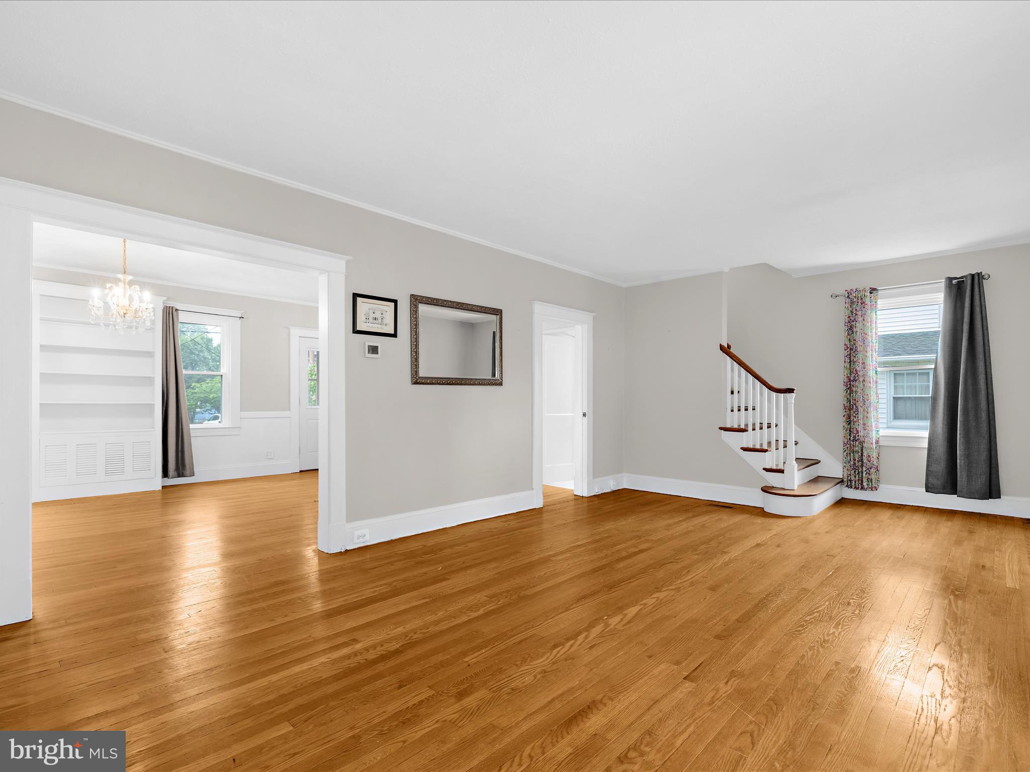 112 Homewood Road Linthicum Heights, MD 21090 - Photo 10 of 44 a view of an empty room with wooden floor and a window