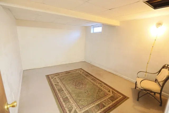 a bathroom with a toilet sink and shower