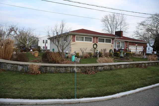 a view of a house with a backyard and a backyard