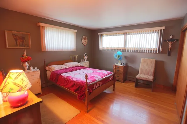 a very nice looking room with a dining table a chandelier