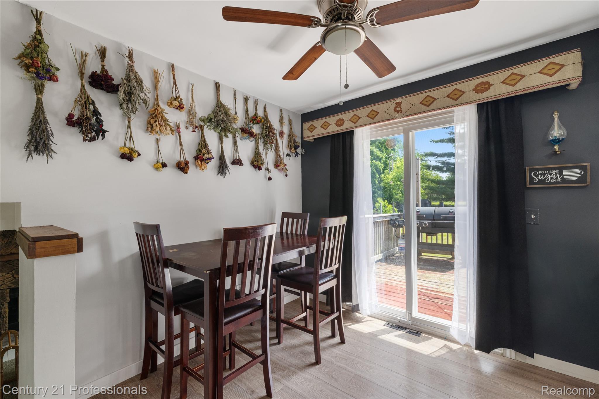 15037 Hogan Road Linden, MI 48451 - Photo 9 of 38 Dining area featuring wood-finish flooring and a ceiling fan