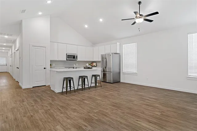 a view of a house with a backyard and windows