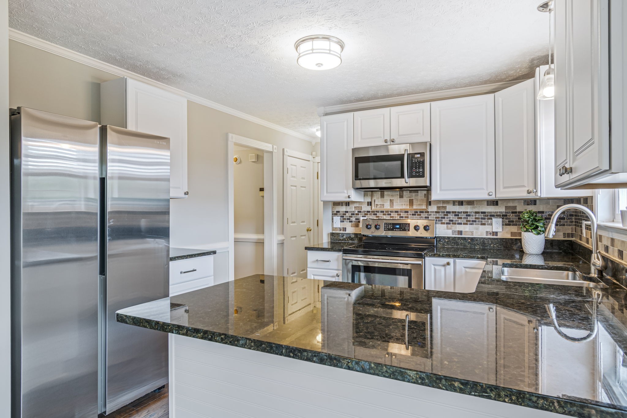 3137 Southall Road Franklin, TN 37064 - Photo 13 of 51 a kitchen with stainless steel appliances granite countertop a sink a stove and a refrigerator