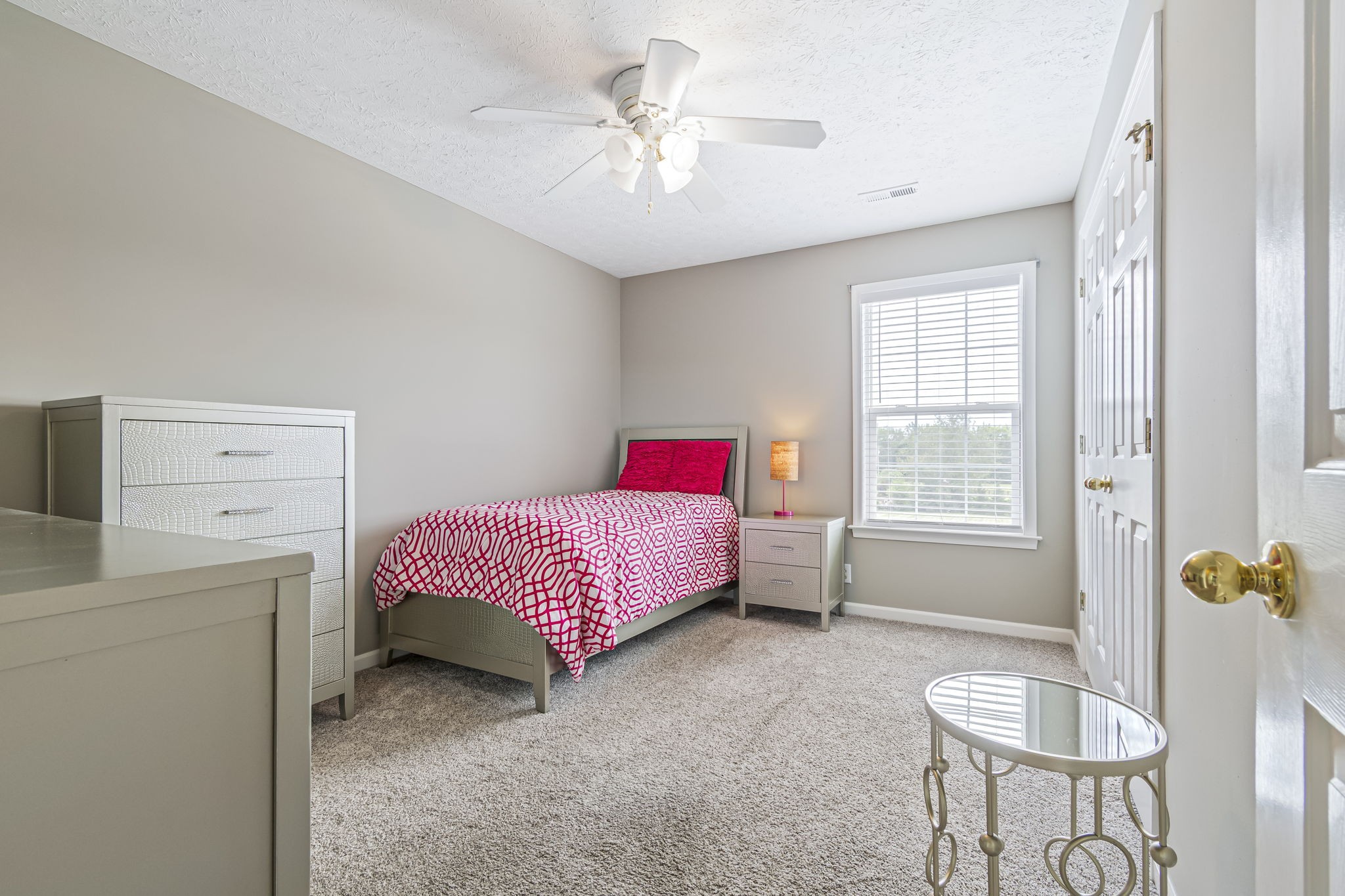 3137 Southall Road Franklin, TN 37064 - Photo 22 of 51 a bedroom with a bed and a chandelier