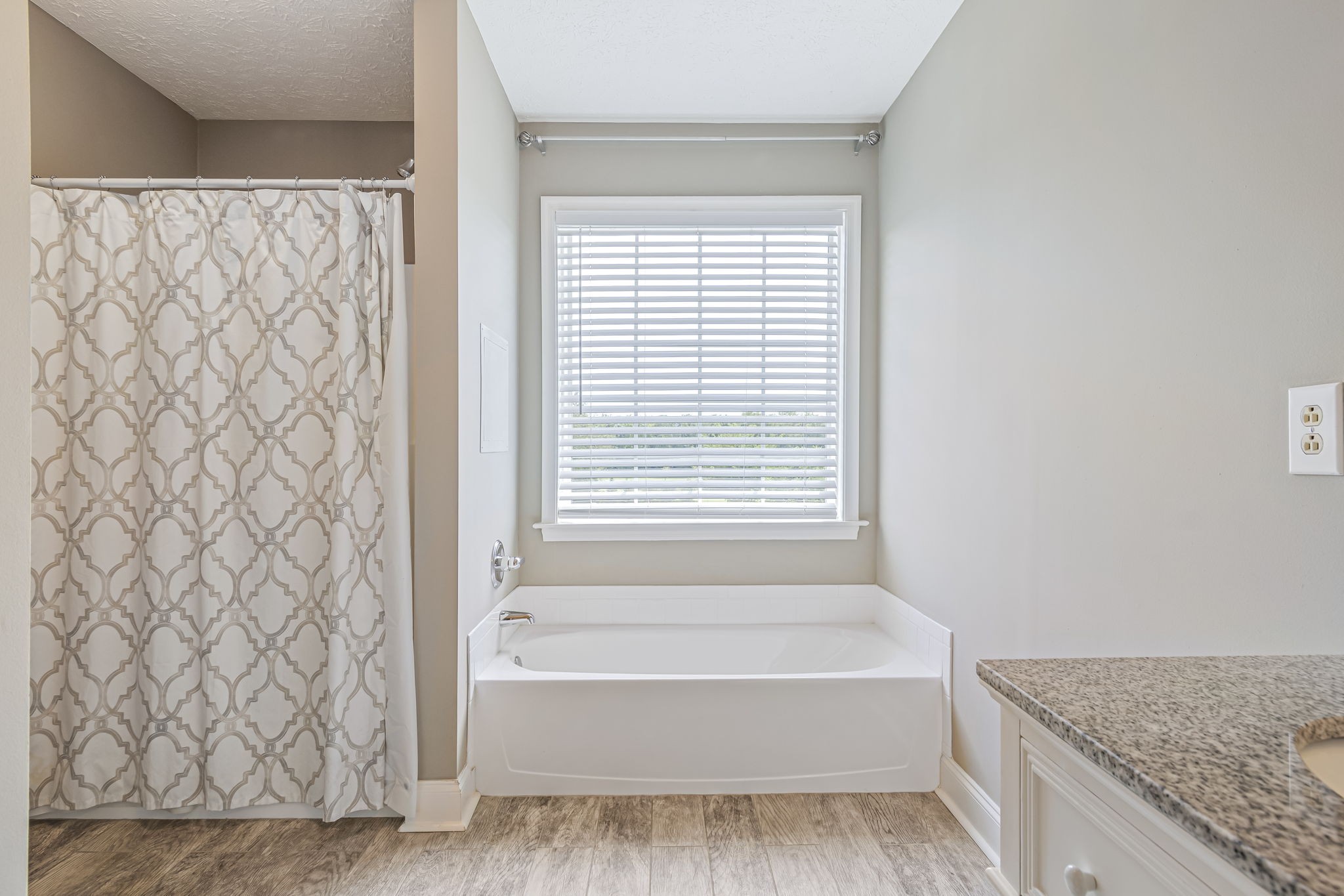 3137 Southall Road Franklin, TN 37064 - Photo 30 of 51 a bathroom with a granite countertop bathtub and shower