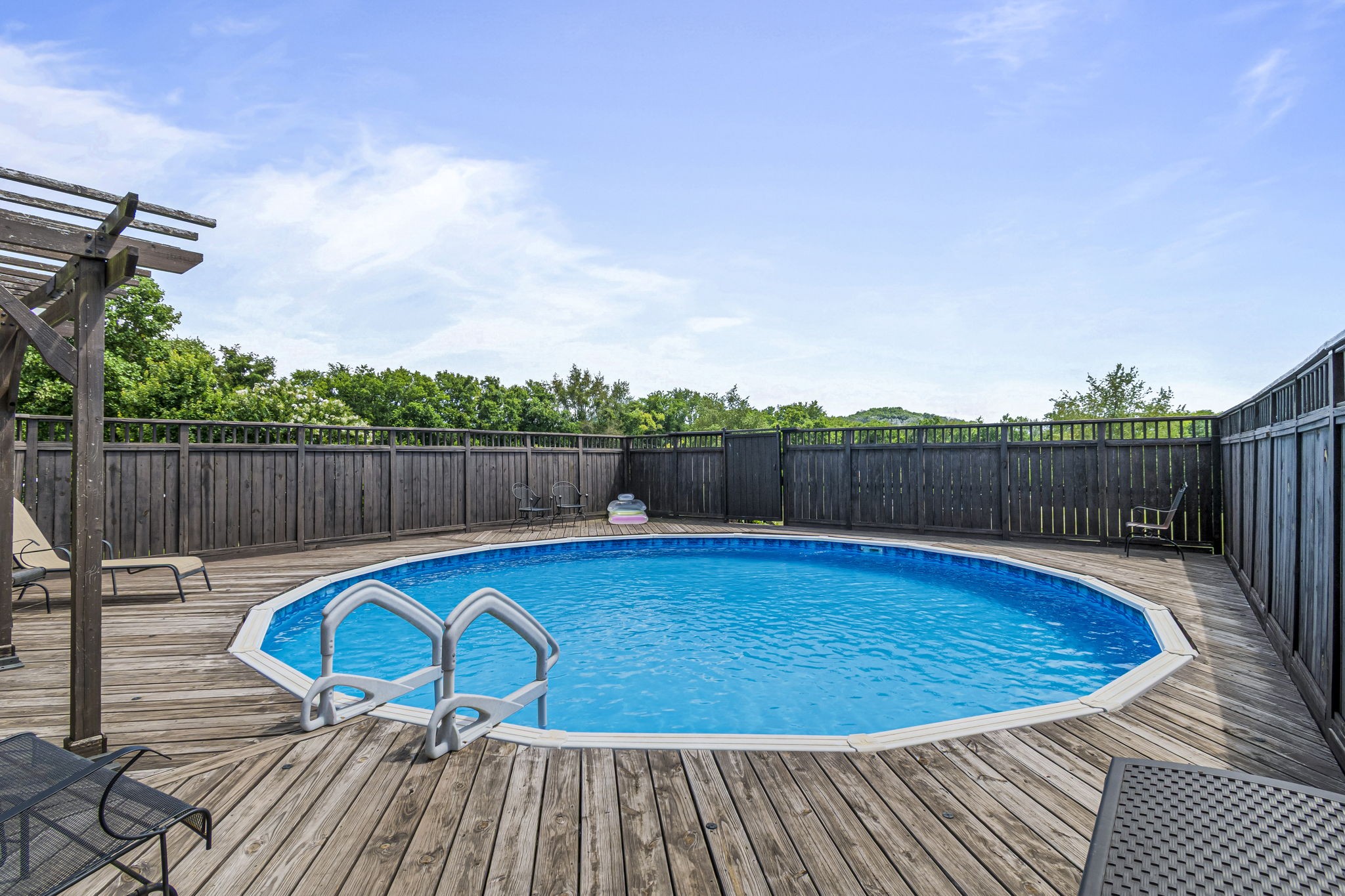 3137 Southall Road Franklin, TN 37064 - Photo 37 of 51 a small pool with lawn chairs and wooden fence