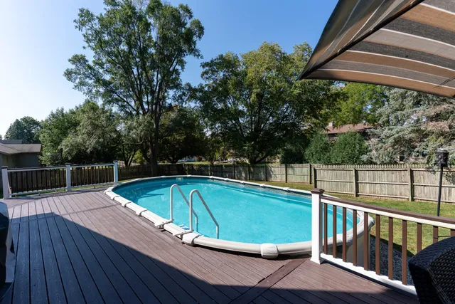 a view of a swimming pool with a patio