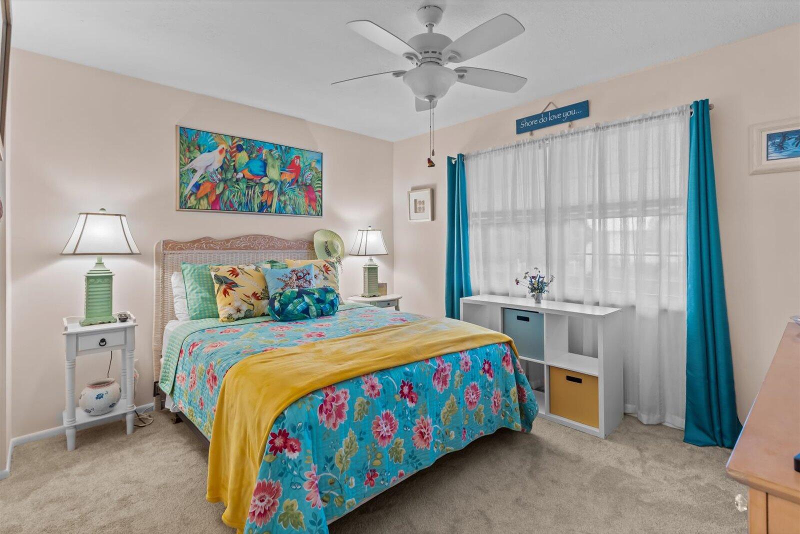 2929 Southeast Ocean Boulevard, Unit 1309 Stuart, FL 34996 - Photo 16 of 29 a bedroom with a bed and a chandelier