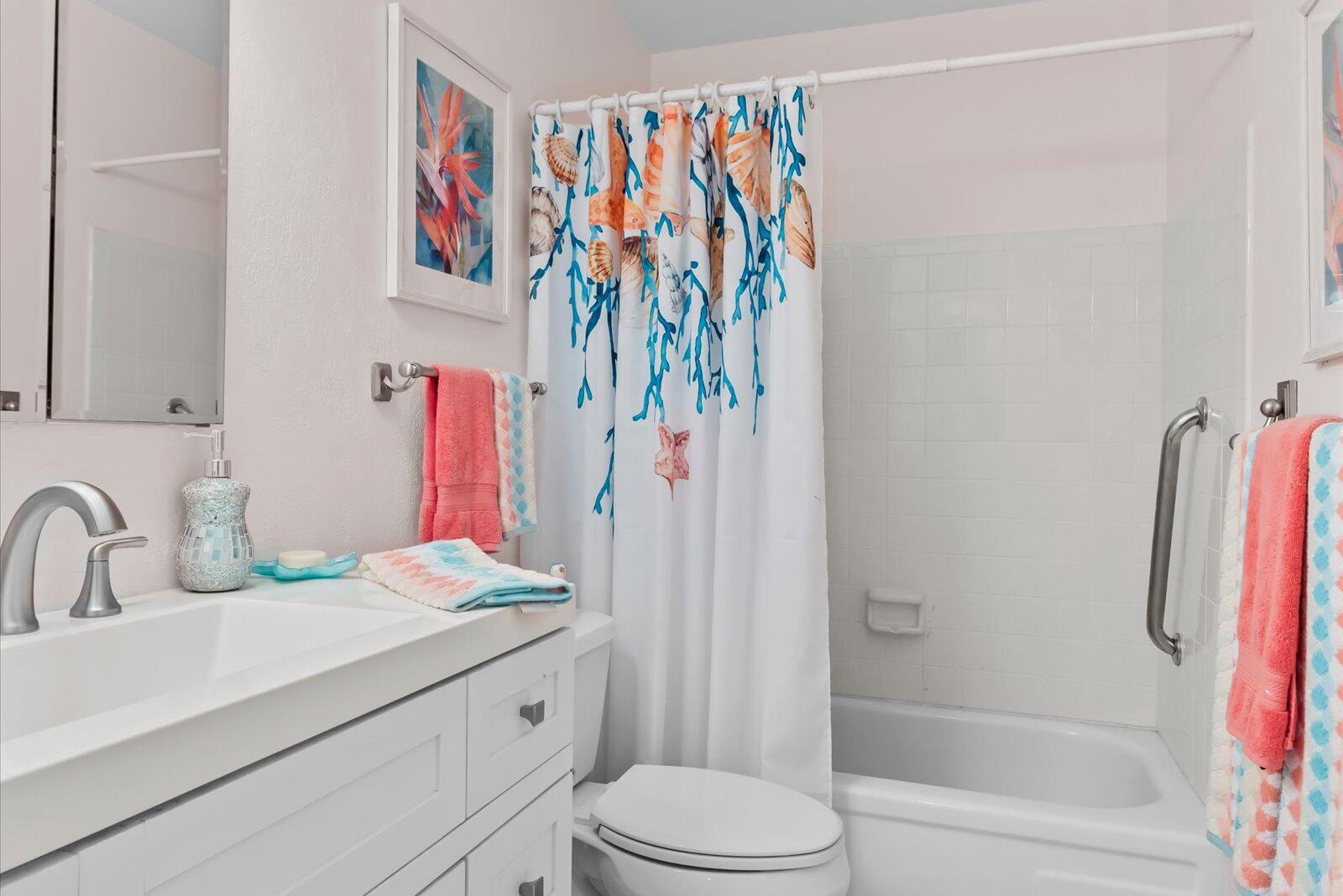 2929 Southeast Ocean Boulevard, Unit 1309 Stuart, FL 34996 - Photo 19 of 29 a bathroom with a sink vanity mirror and toilet