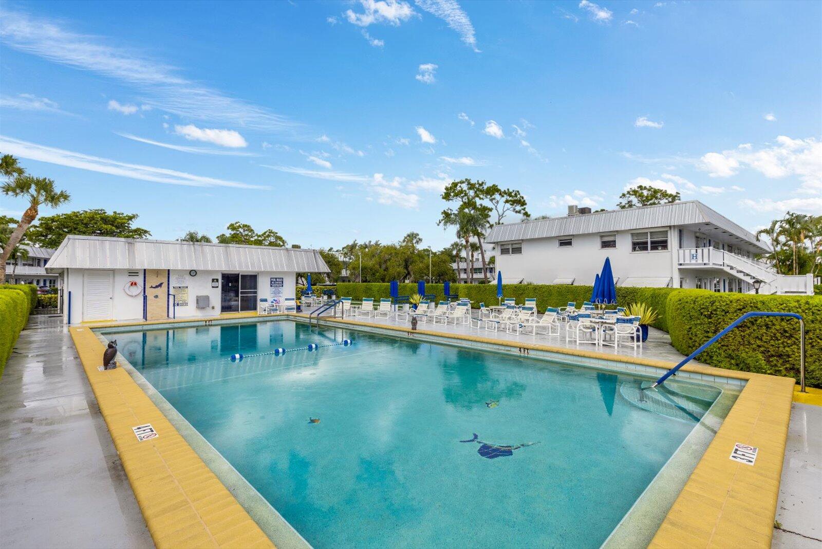 2929 Southeast Ocean Boulevard, Unit 1309 Stuart, FL 34996 - Photo 28 of 29 a view of a swimming pool with a patio