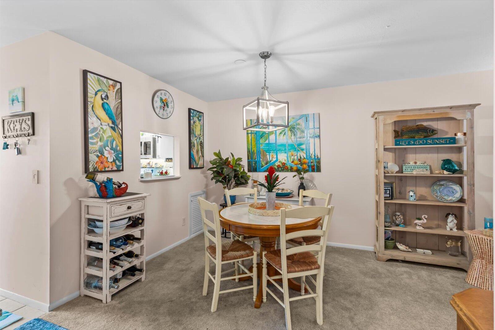 2929 Southeast Ocean Boulevard, Unit 1309 Stuart, FL 34996 - Photo 4 of 29 a view of a dining room with furniture