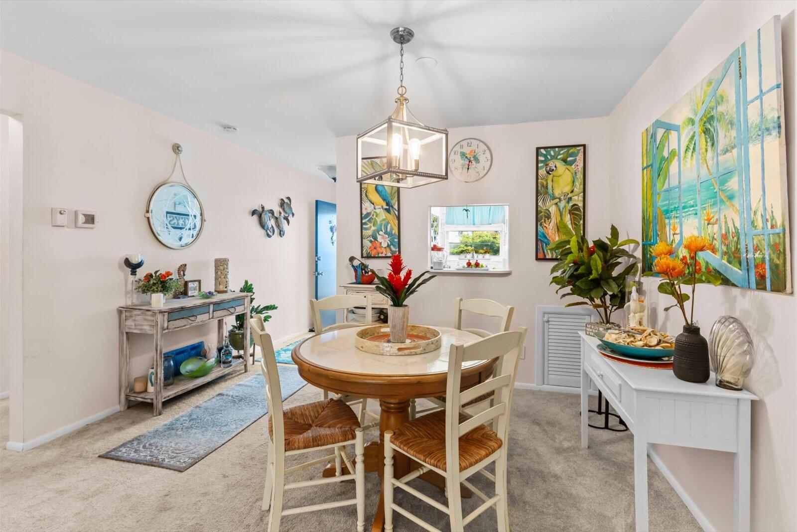 2929 Southeast Ocean Boulevard, Unit 1309 Stuart, FL 34996 - Photo 5 of 29 a view of a dining room with furniture window and wooden floor
