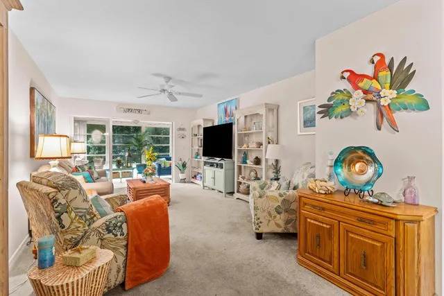 a living room with furniture fireplace and flat screen tv