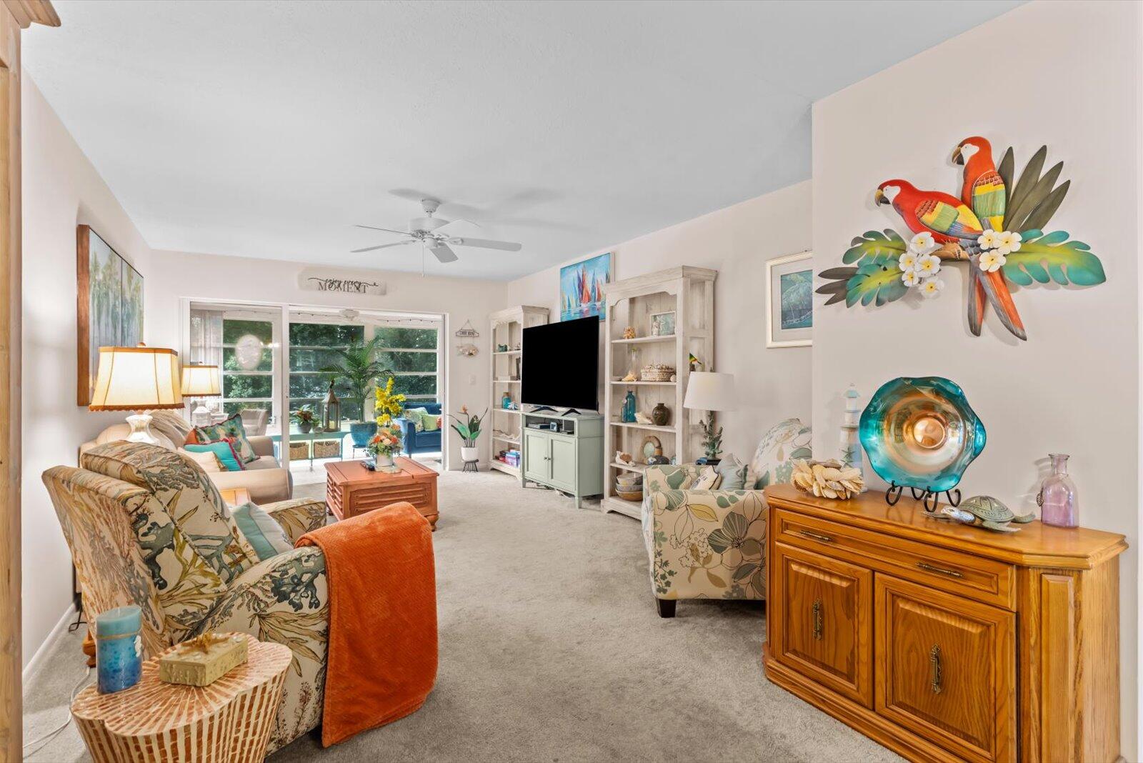 2929 Southeast Ocean Boulevard, Unit 1309 Stuart, FL 34996 - Photo 6 of 29 a living room with furniture fireplace and flat screen tv