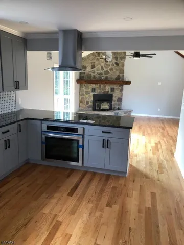 a kitchen with stainless steel appliances granite countertop a stove a sink dishwasher and a refrigerator