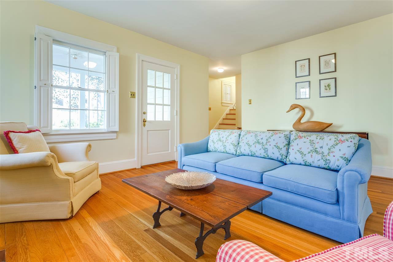 2514 Beechridge Road Raleigh, NC 27608 - Photo 11 of 25 a living room with furniture and a table