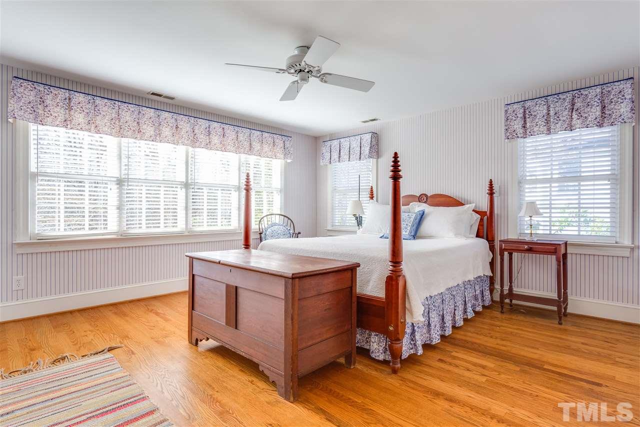 2514 Beechridge Road Raleigh, NC 27608 - Photo 18 of 25 a bedroom with a bed and a large window