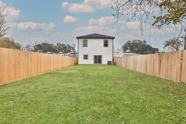 a view of a backyard of the house